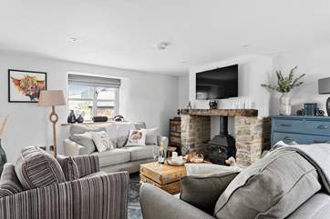 Relax in front of the wood-burner and watch a movie on the Smart TV.