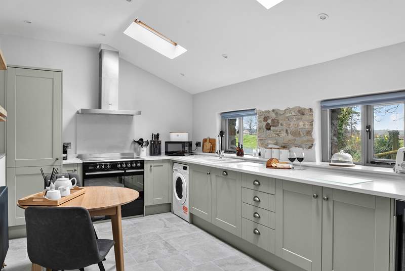With light from Velux windows and countryside views, the kitchen is simply lovely.
