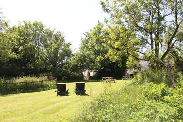 Relax in the gorgeous garden looking back to Moonlit Barn.