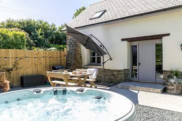 Welcome to Moonlit Barn!
The hot tub sits directly outside the front door on a beautiful patio area perfect for those lazy days.