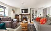 Relax in front of the wood-burner and watch a movie on the Smart TV. - Thumbnail Image