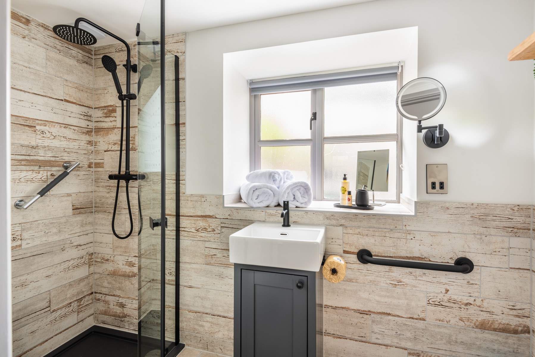 The en suite has a walk-in rainfall shower.