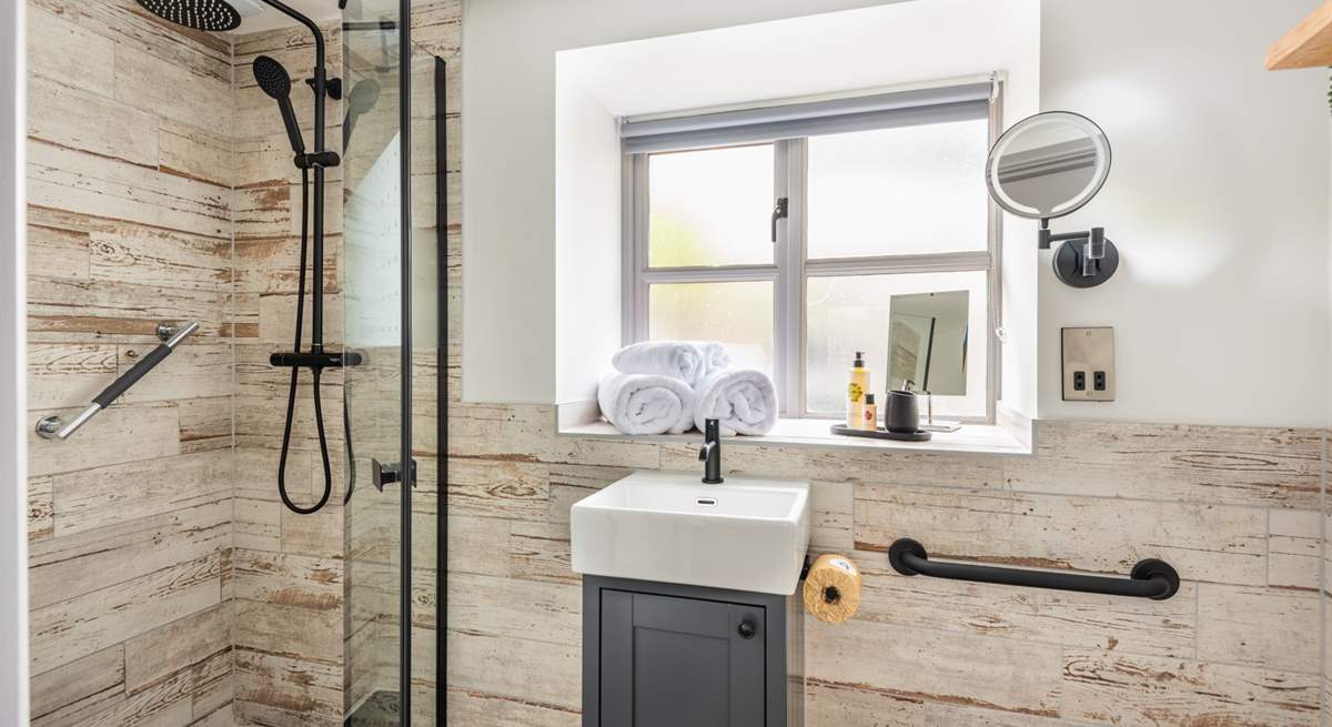 The en suite has a walk-in rainfall shower.