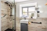 The en suite has a walk-in rainfall shower.