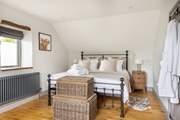 The gorgeous six-foot super-king bed in bedroom 3.