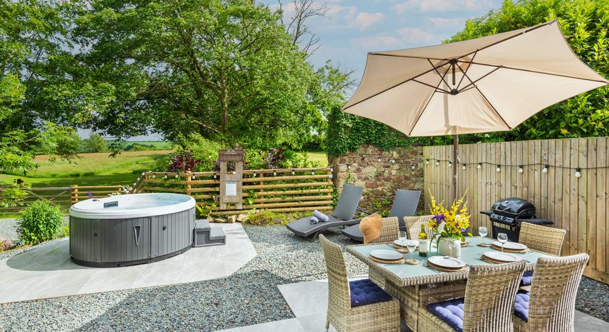 The Barn enjoys a beautiful al fresco patio area with that all important hot tub!