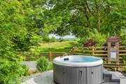 Take a dip in the hot tub surrounded by nature!