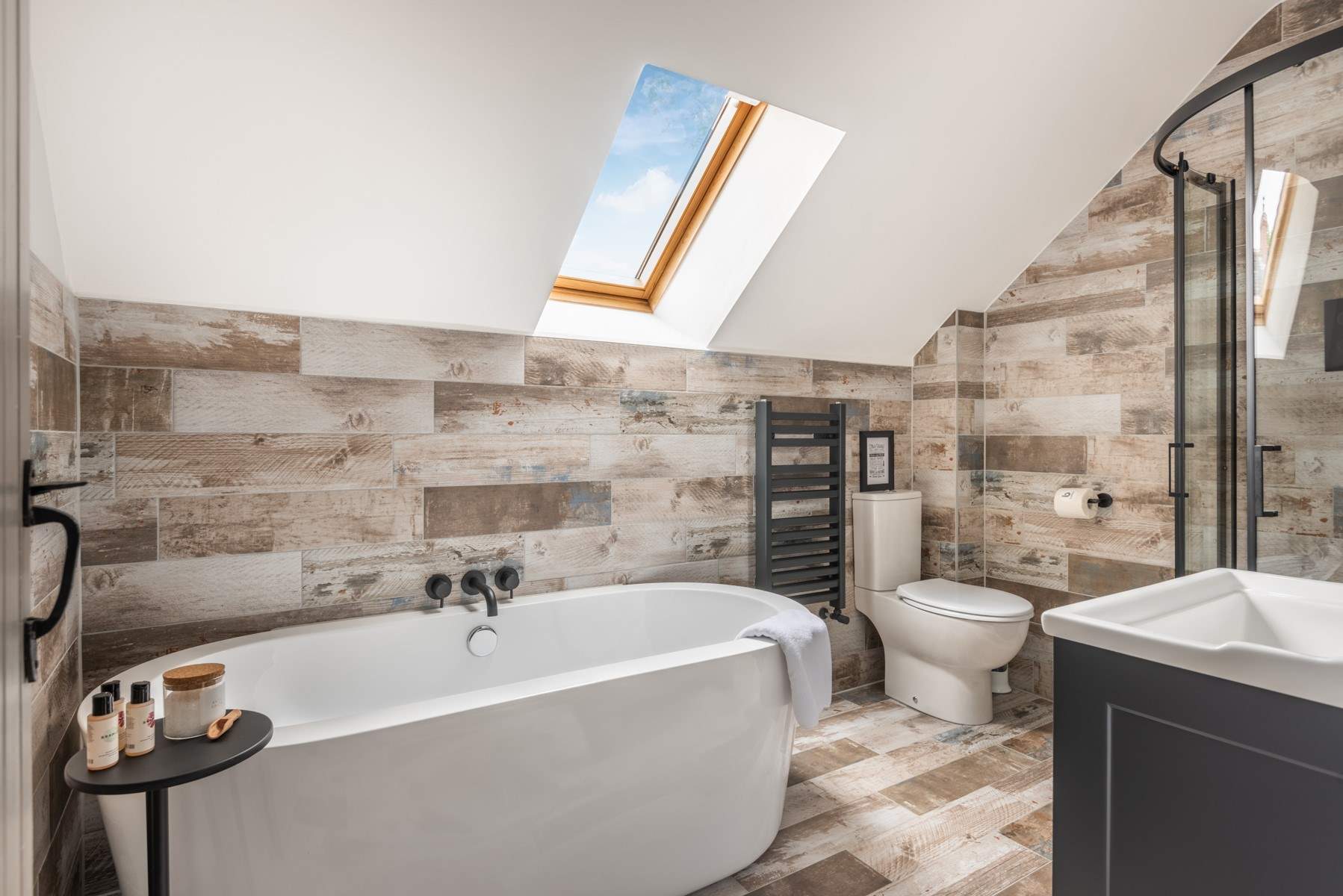 The gorgeous family bathroom is perfect for a long soak after a busy day.