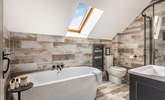 The gorgeous family bathroom is perfect for a long soak after a busy day. - Thumbnail Image