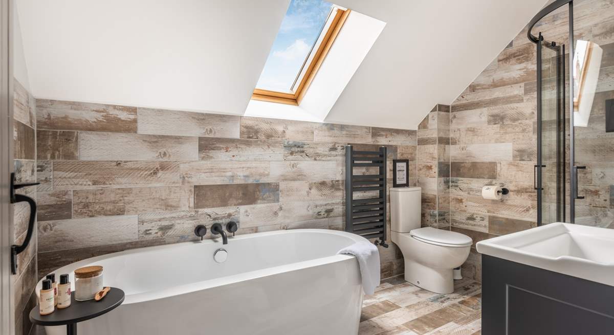 The gorgeous family bathroom is perfect for a long soak after a busy day.