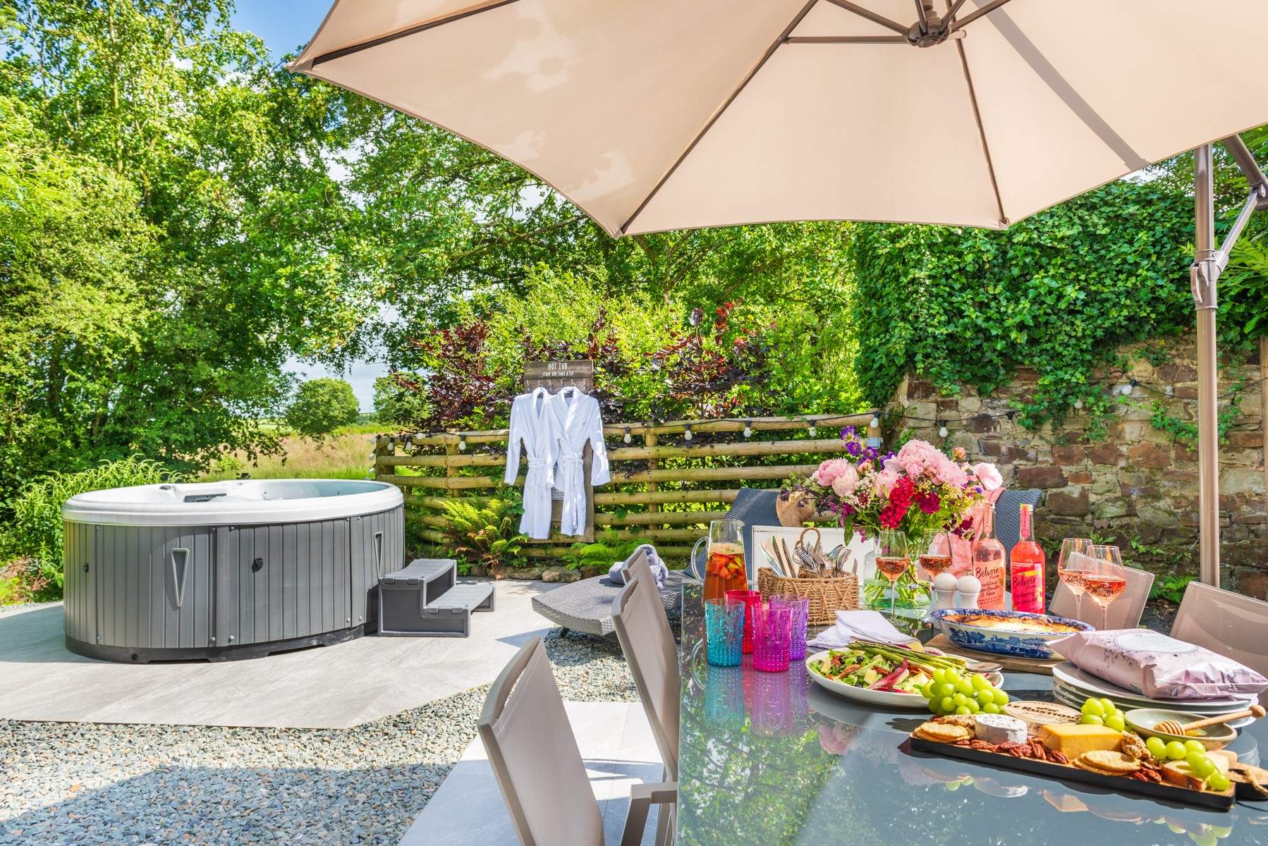 The Barn enjoys a beautiful al fresco patio area with that all important hot tub!