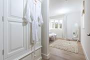 The main bedroom is decorated in muted tones for a restful night's slumber.