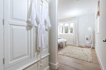The main bedroom is decorated in muted tones for a restful night's slumber.