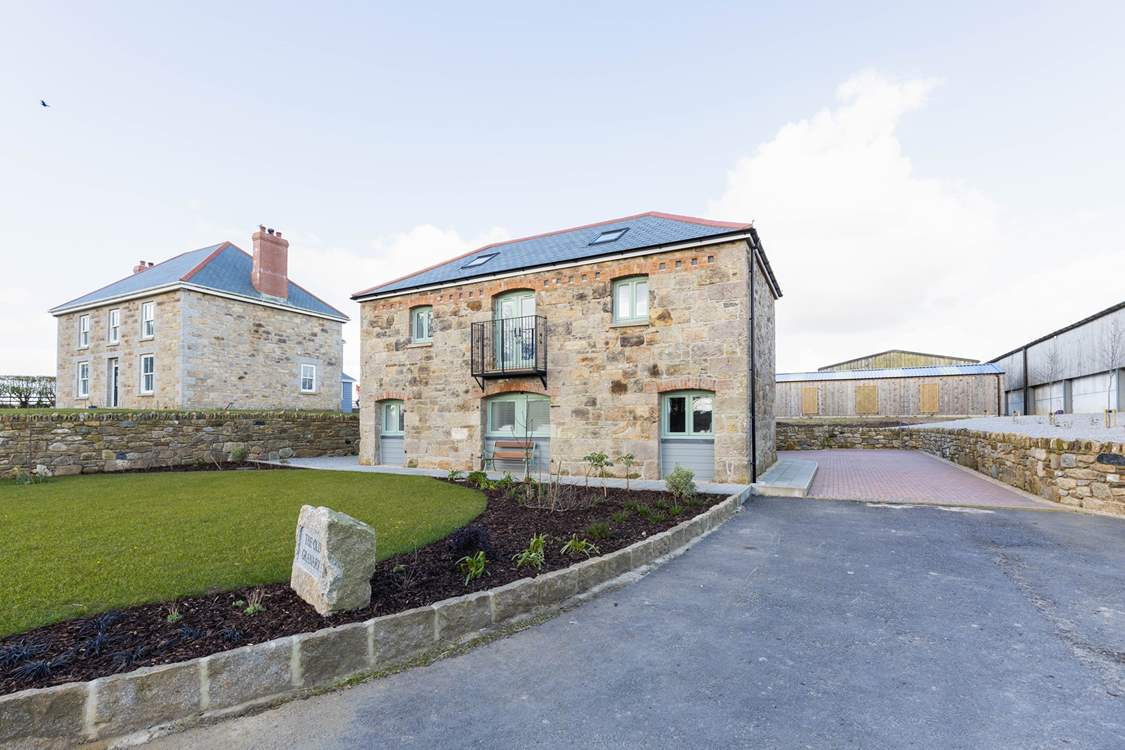 The Old Granary has an area of lawn and a hidden patio to the side of the property.  The barns behind are only used in the winter months to house dairy cows so you might hear the occasional sound of lowing.