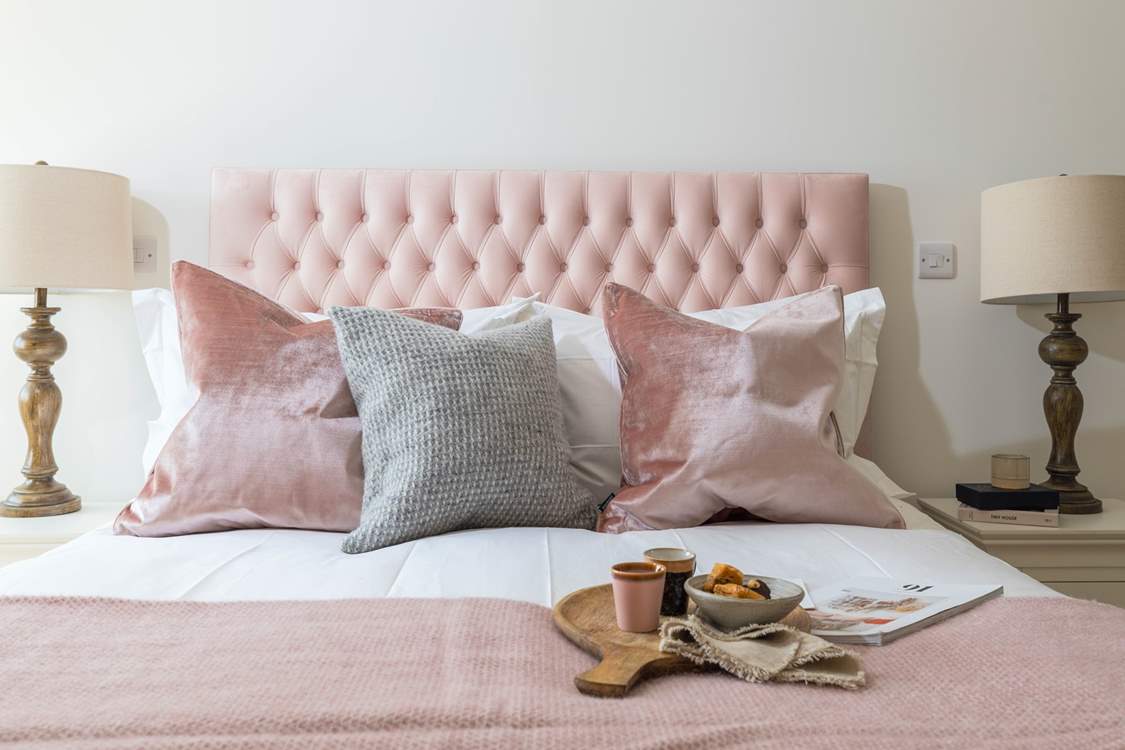 This bedroom has a king-size bed an en suite shower-room.