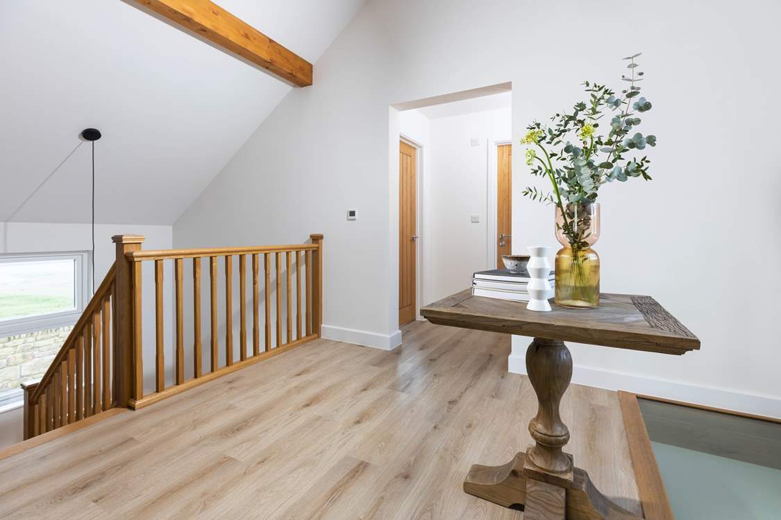 The large landing on the first floor has feature glass floor panel looking down to the entrance hall below.