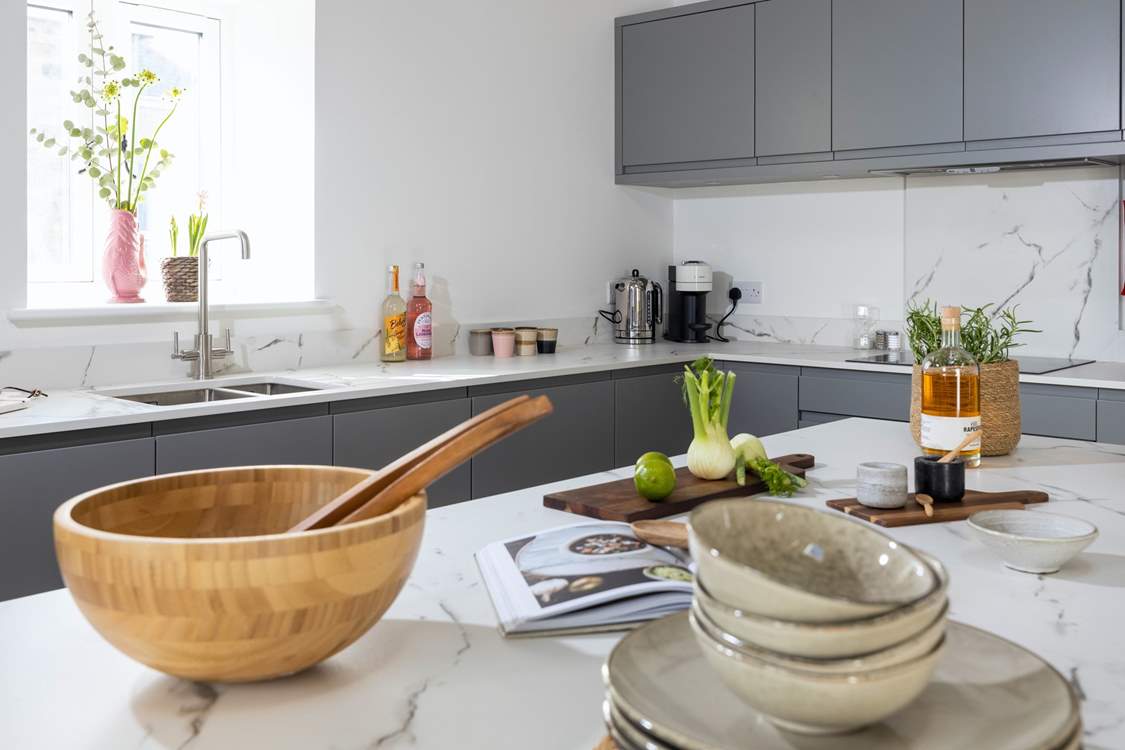 The stylish kitchen is equipped with everything you might need.