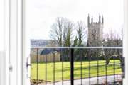 Double doors open from the first floor onto views of the pretty church and surrounding countryside.