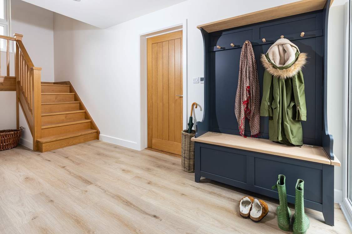 The large entrance hall has plenty of space for muddy boots and sandy flip flops.