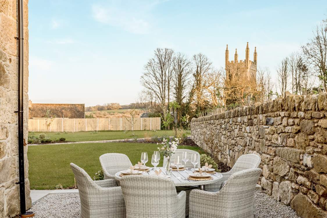 Enjoy the outdoor space with its lovely views of the pretty church.