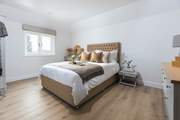 Calming tones for a restful slumber can be found in this bedroom (Bedroom 3).