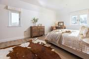 The principal bedroom has an en suite shower-room and views over the church and rolling countryside beyond.