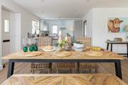 Pull up a chair and enjoy long meals around the table, planning your next day's adventure. The house also has charming art work by Amanda Hunt paying tribute to the cows.