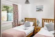 The pretty twin bedroom overlooks the peaceful back garden.