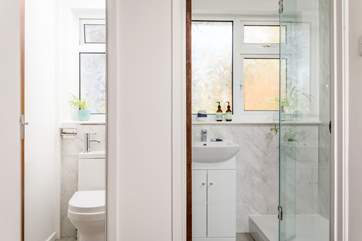 The family shower-room has a shower and wash-basin, with a WC and wash-basin adjacent.