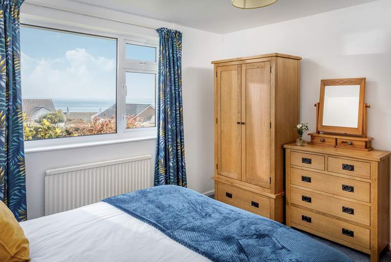 The cosy double bedroom has sea views.