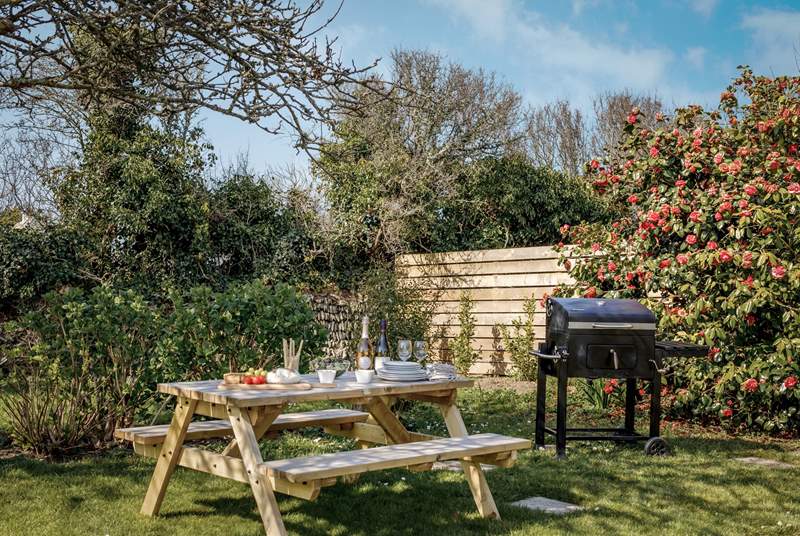 The back garden is a delight and the perfect place for al fresco dining in the dappled light of the surrounding trees.