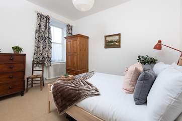 Bedroom 2 is on the first floor and has a double bed with luxury linens.