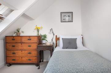 The pretty single bedroom on the second floor.