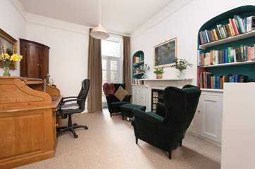With a desk and two comfy chairs, the snug (part of the sitting-room) is the perfect place for a quiet read, or perhaps to catch up if work calls.