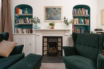 The 'snug', part of the sitting-room, has a beautifully restored, original fireplace (ornamental only).