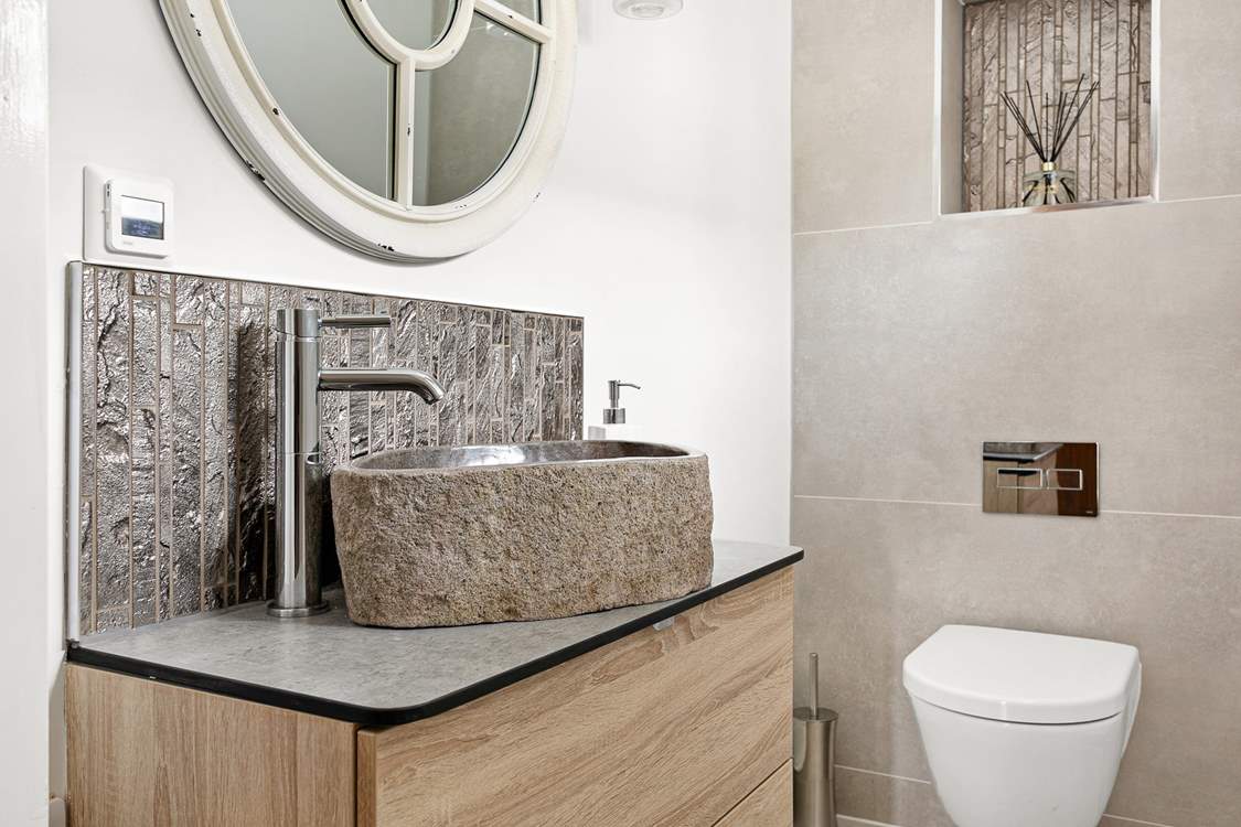 Even the downstairs cloakroom is super swish.