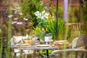 Beautiful gardens surround the outside dining area.