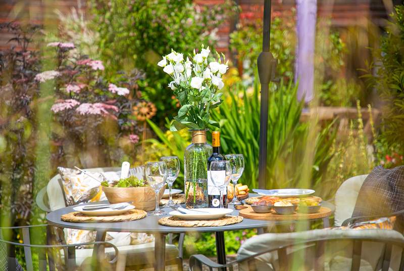 Beautiful gardens surround the outside dining area.