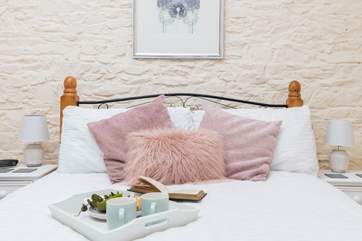 The dreamy double bedroom has lovely linens to ensure a great night's sleep.
