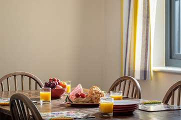 Linger over late lunches and savour early suppers around the rustic dining-table.