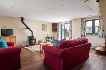 The charming sitting-room has everything you'll need to relax.