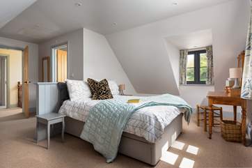 The inviting king-size bed ensures a good night's sleep.