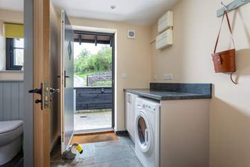 A handy utility-room sits at the rear of the barn.