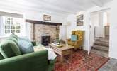 The snug has a feature fireplace and the all important wood-burner. - Thumbnail Image