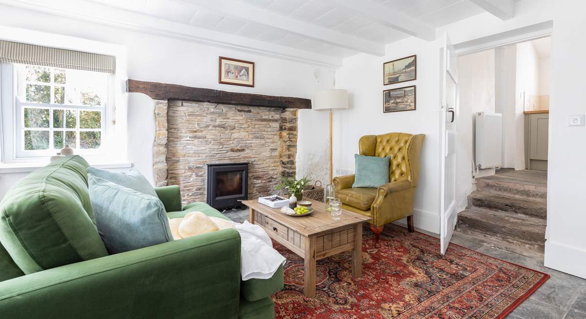 The snug has a feature fireplace and the all important wood-burner.