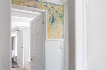 This unique feature is actually hundreds of years of paint which has cleverly been sanded away to show the layers of time beneath!