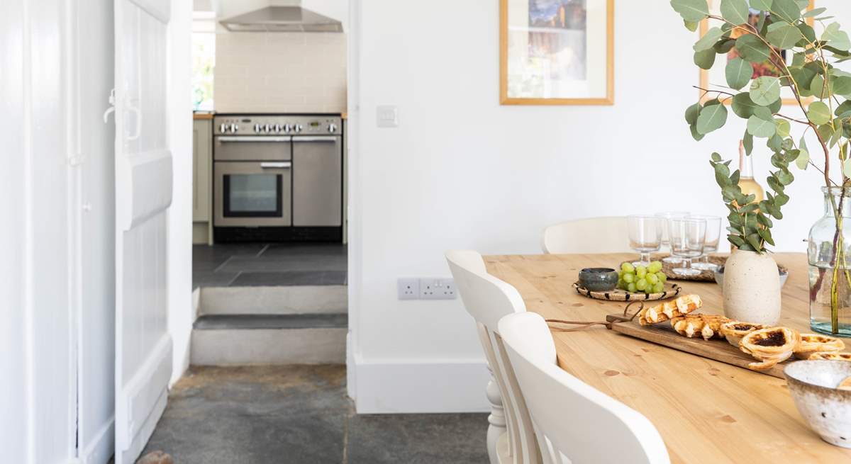 Two steps lead from the kitchen into the dining-room.