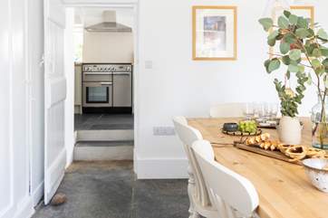 Two steps lead from the kitchen into the dining-room.