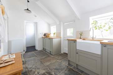 The handy utility-room has a washing machine/drier and plenty of space for beach equipment. The wet-room adjoining the utility-room is perfect for rinsing salty toes.