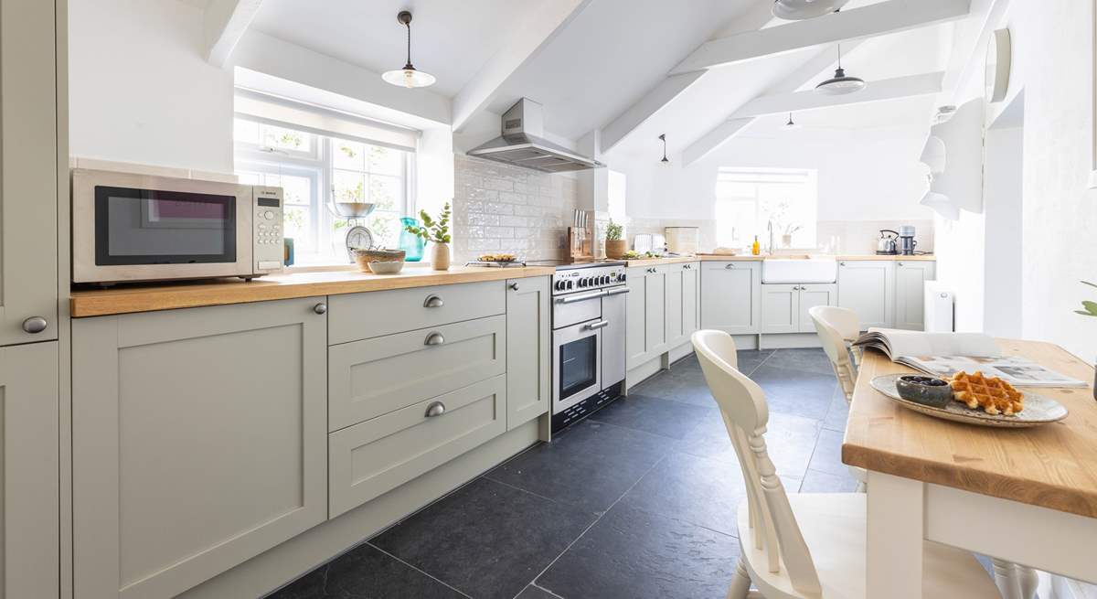 A breakfast table for two in the kitchen is the perfect place to sit and chat with the chef.